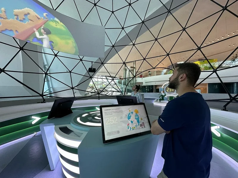 Interactive carbon calculator installation inside a geodesic dome, built by Harikalar